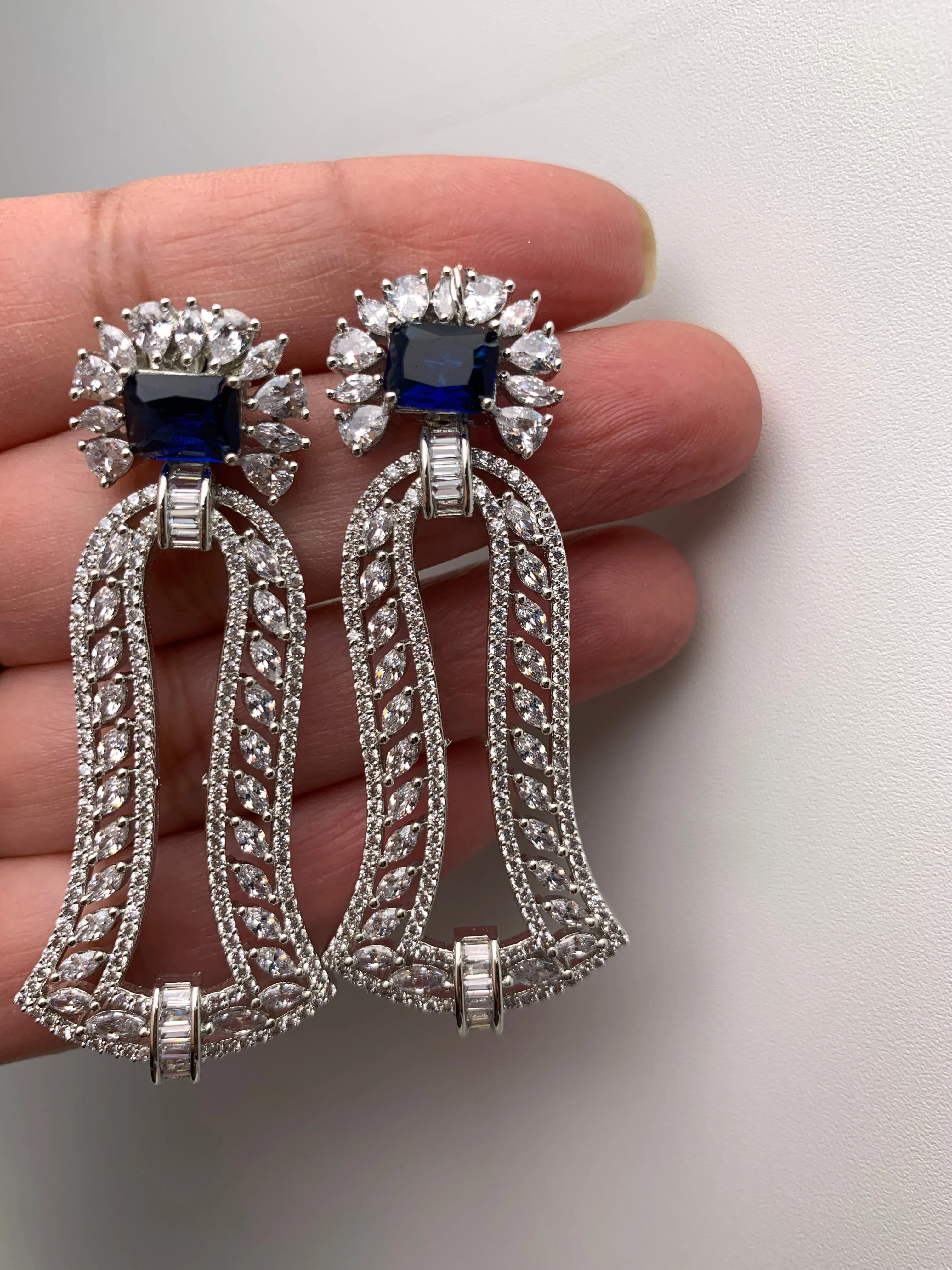 AD Blue Stone Bell Pattern Earrings in Silver Polish